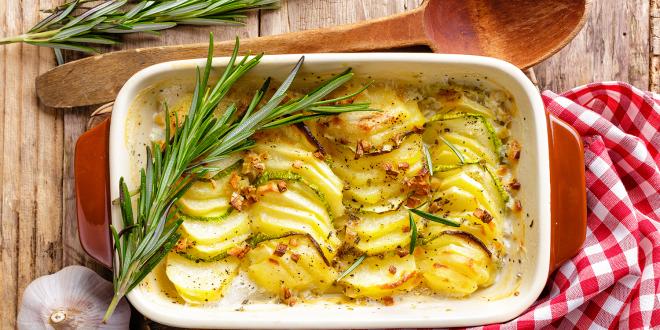A dish of potatoes au gratin with rosemary
